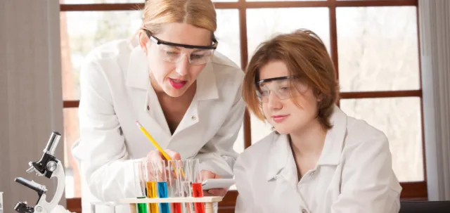 Student and teacher in the Chemistry lab.