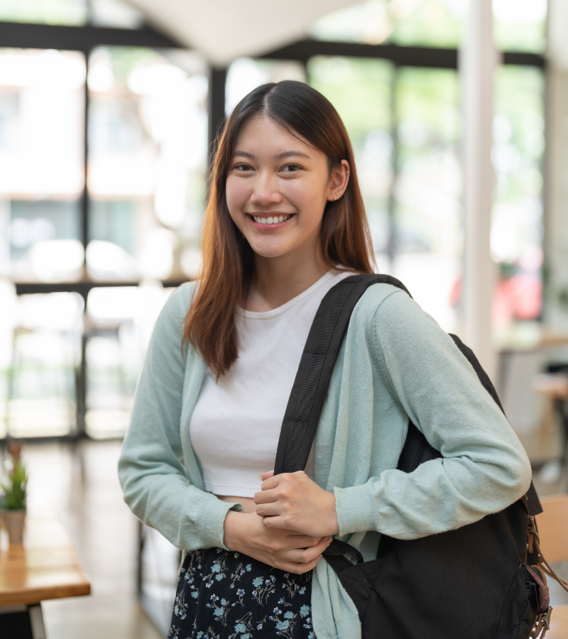 Smiling Bruce College Student with Bag
