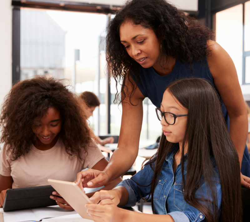 Teacher supporting students with study